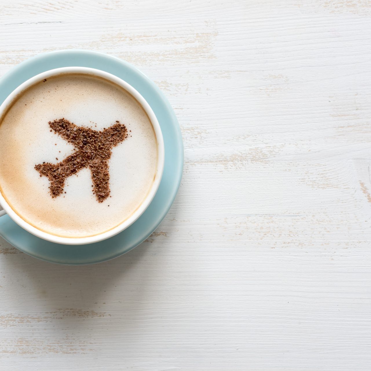 Airplane Made Of Cinnamon In Coffee. Cup Of Cuppuccino. Travel Concept
